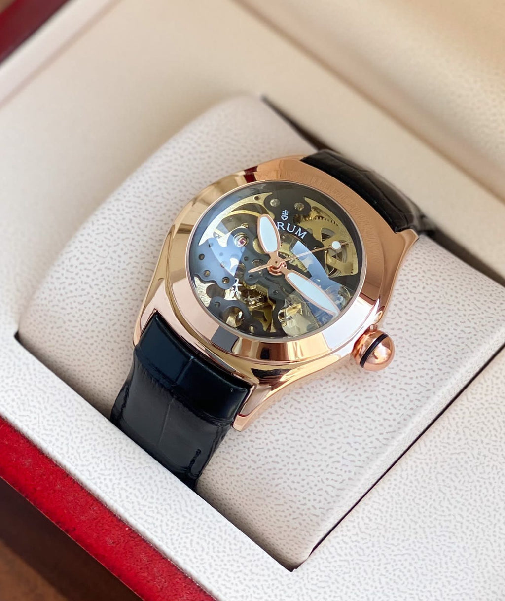 Corum Inspired Automatic Watch – 44mm Rose Gold Case, Black Leather Strap, 7AAA Premium Quality, Transparent Caseback